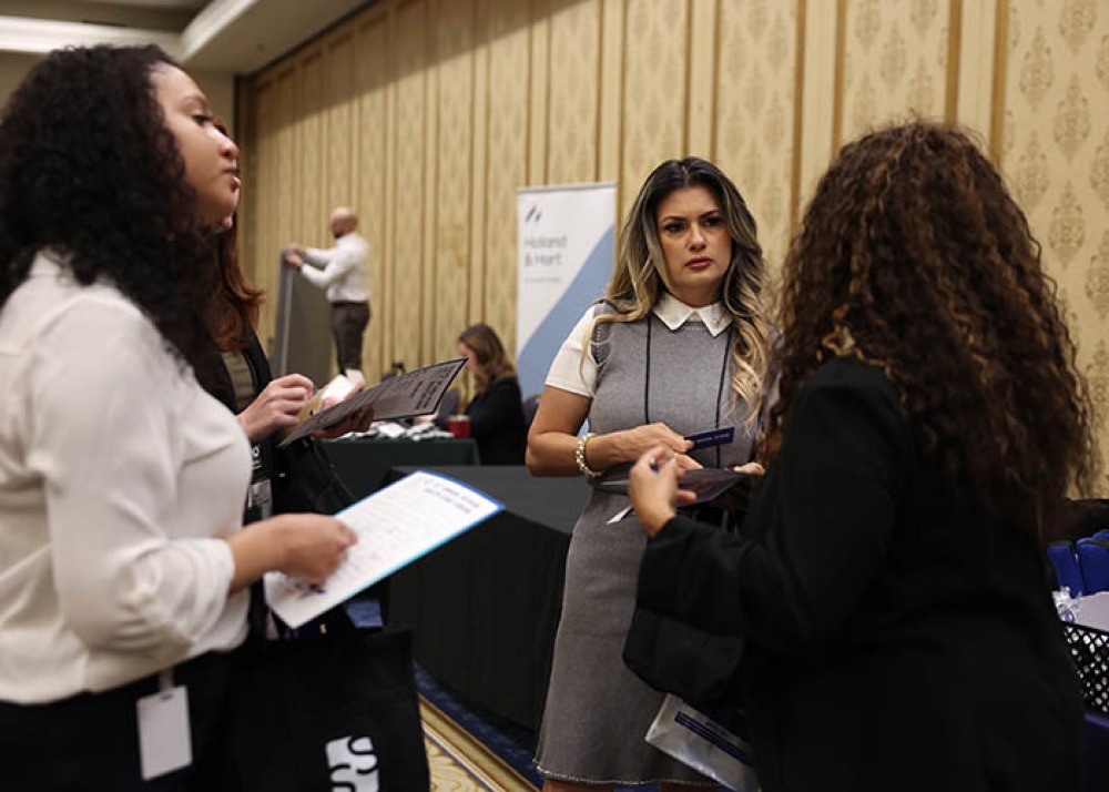 Healthcare professionals in conversation at a HEALS networking event